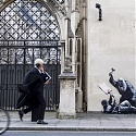 Banksy Unveils A New Mural Of A Judge Beating A Protester Outside London Court